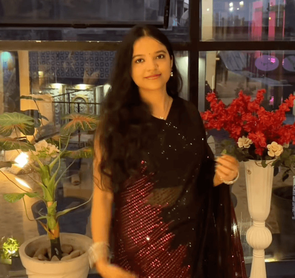 Shivangi in a black sequined sari